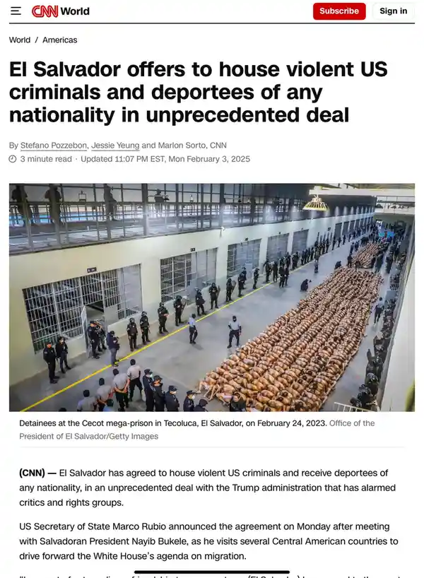 A high-angle photo shows hundreds of shirtless detainees lying in rows on the floor of a large, institutional prison yard…