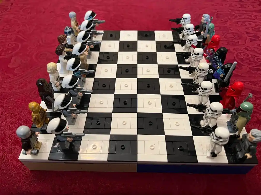 A custom-built LEGO chess set features Star Wars characters as pieces, with the white side including Stormtroopers and the…
