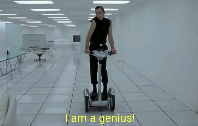 A person in a black sleeveless top and pants stands on a silver two-wheeled personal transporter in a long, sterile…