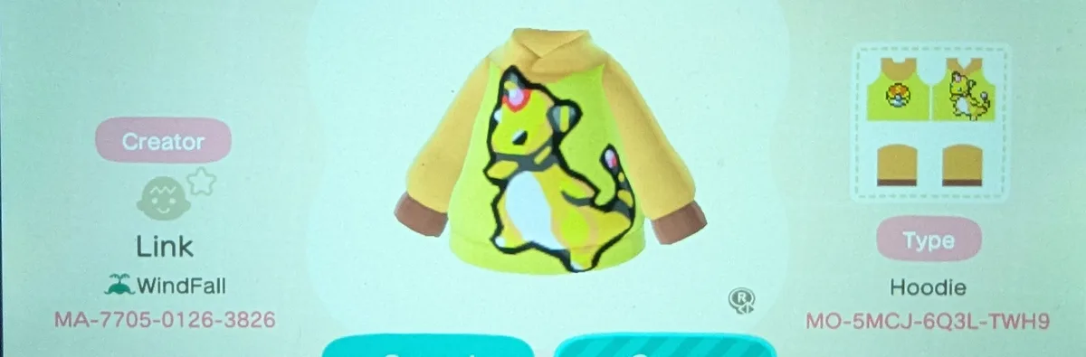 A screenshot from Animal Crossing: New Horizons displays a custom yellow hoodie with a large, stylized cartoon cat design on…