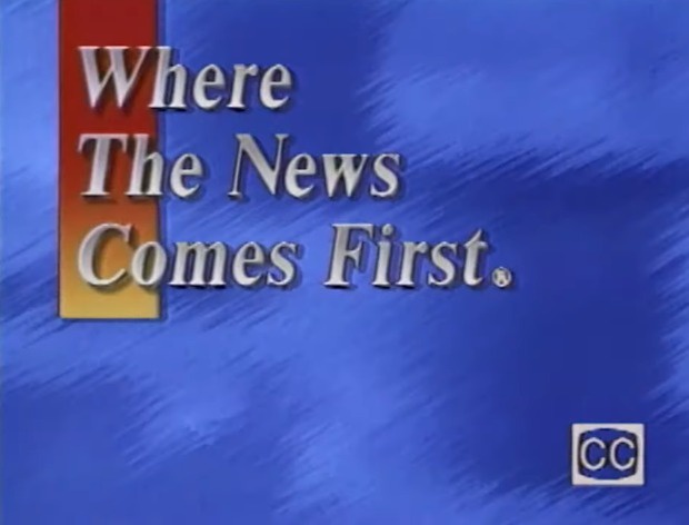 A blue background with a red and yellow vertical bar on the left. White serif text reads 'Where The News Comes First.' with…