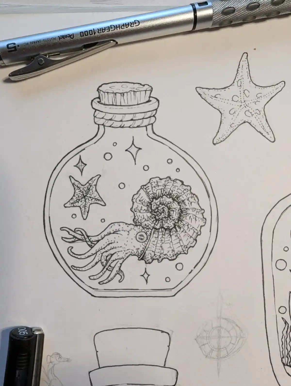 A black-and-white line drawing on paper shows a hand-drawn bottle with a cork stopper, containing a squid, an ammonite…