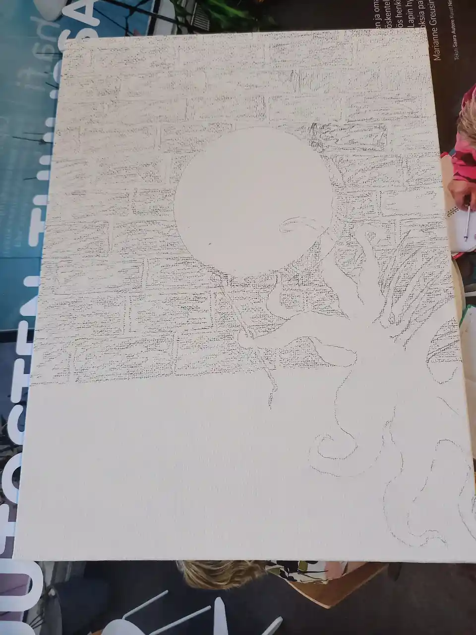 A white canvas shows a pencil sketch of an octopus with a large blank circle for a head and tentacles drawn around it, with…