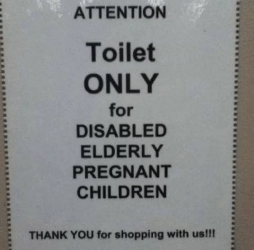 A close-up of a white sign with black text that reads 'ATTENTION Toilet ONLY for DISABLED ELDERLY PREGNANT CHILDREN' and…
