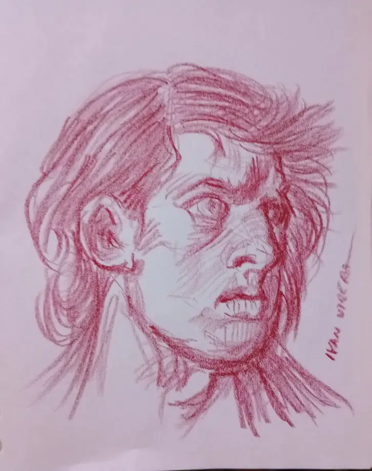 A red pencil sketch on white paper depicts a person's face with wild, messy hair and an intense, angry expression, mouth…