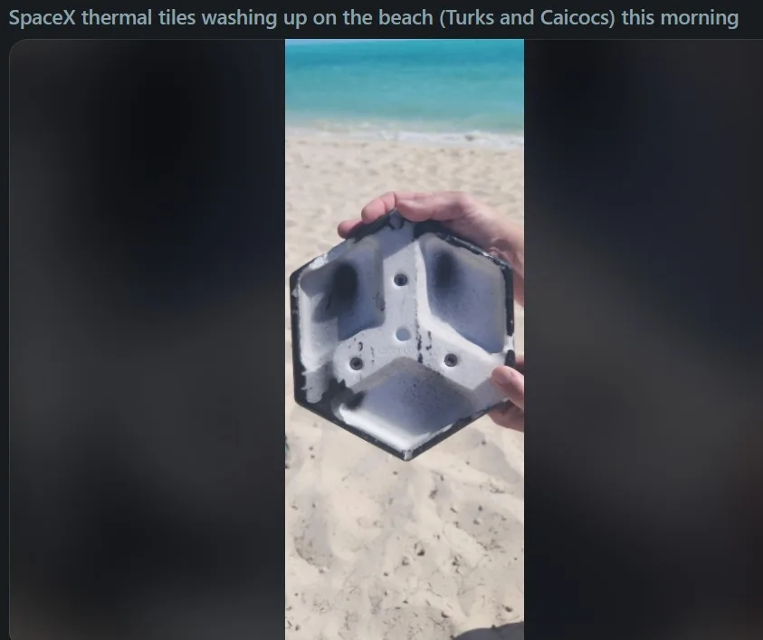 A person holds up a hexagonal, white, porous object with blackened edges and holes, identified as a SpaceX thermal tile…