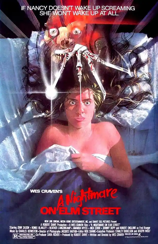 This is the iconic movie poster for 'A Nightmare on Elm Street,' featuring a terrified young woman in bed as a grotesque…