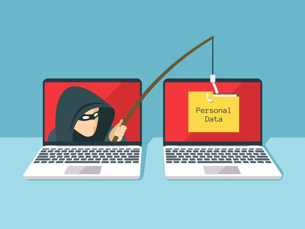 Two laptops sit side by side; the left one shows a hooded hacker holding a fishing rod, casting it toward the right laptop…