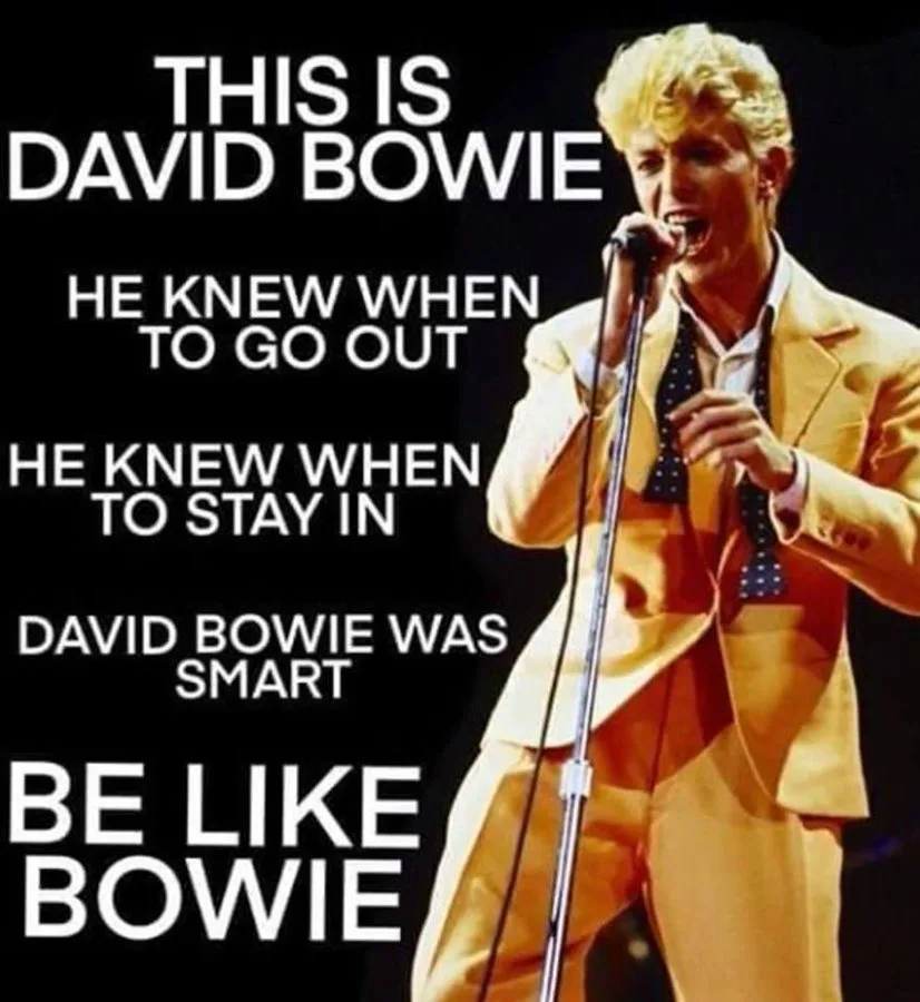 A black background image features a photo of David Bowie performing on stage in a yellow suit and polka-dot tie, holding a…