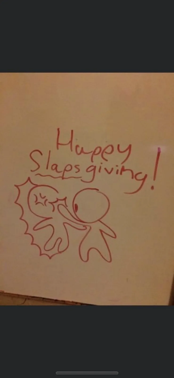 A hand-drawn image in red marker on beige paper shows a simple stick figure giving a slap to another stick figure with a…