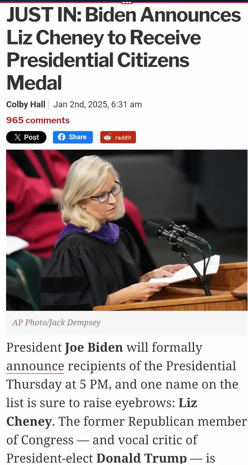 A screenshot of a news article shows a woman with blonde hair and glasses in academic regalia standing at a podium with…