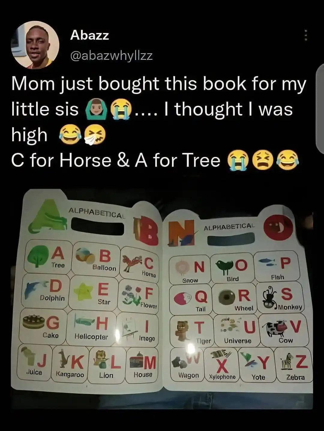 An open children's alphabet book shows incorrect letter-to-word pairings, such as 'C for Horse' and 'A for Tree', which the…