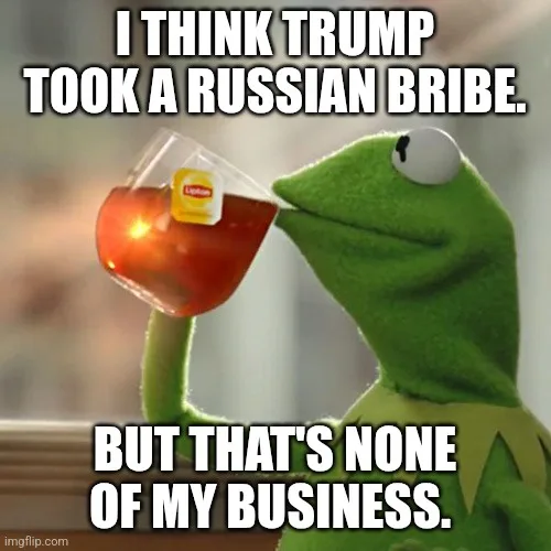 A green frog puppet, Kermit the Frog, is shown sipping from a clear glass teacup containing red tea with a Lipton tea bag…