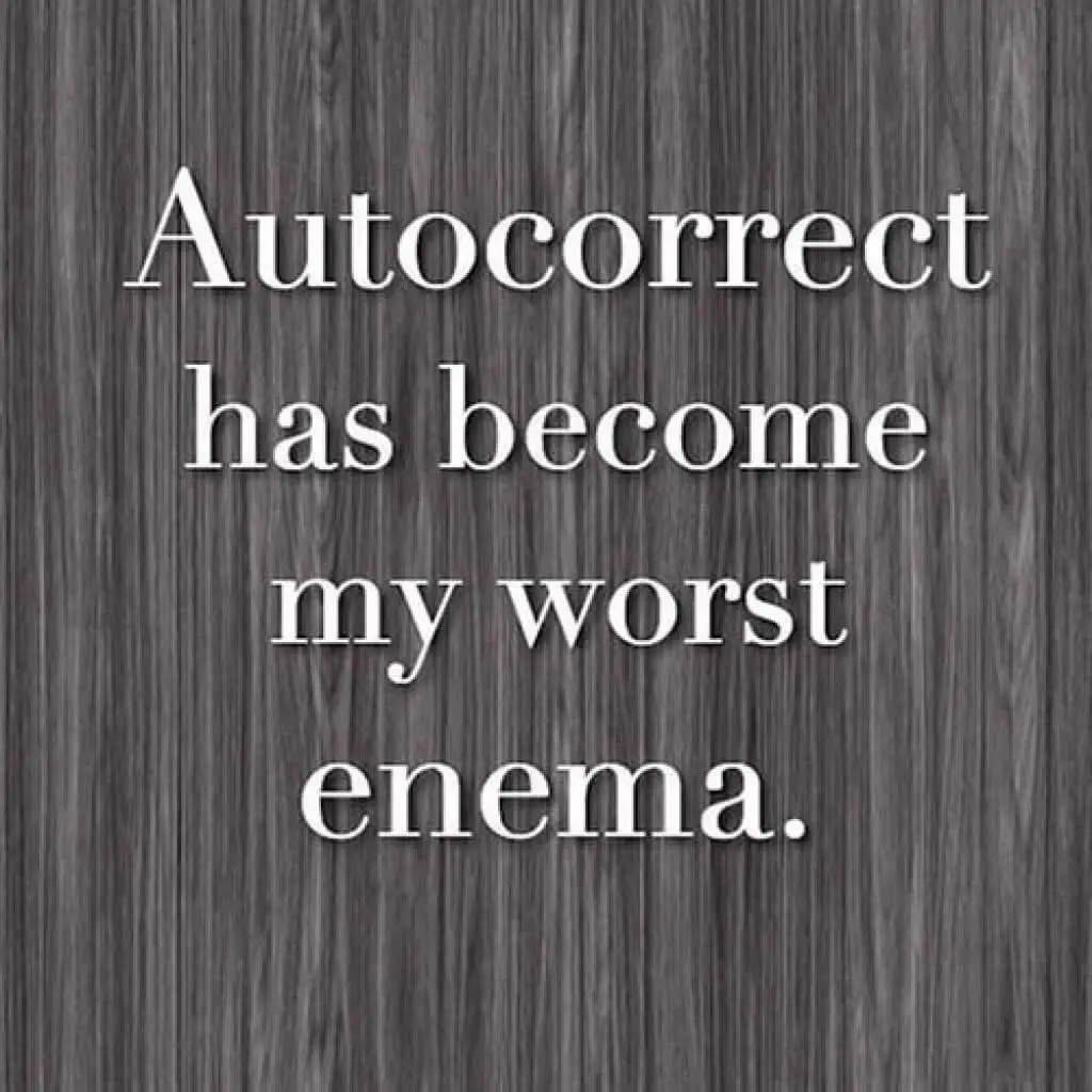 The image displays white serif text centered on a dark gray wood-grain background. The text reads 'Autocorrect has become my…