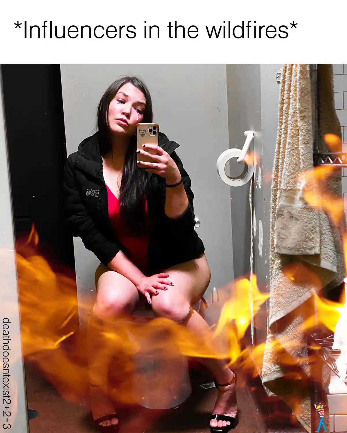 A woman sits on a toilet in a bathroom, taking a selfie in a mirror while flames are digitally added to the bottom half of…