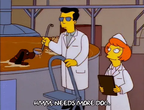 A six-panel comic strip from The Simpsons shows a scientist in a lab coat and sunglasses repeatedly saying 'HMM. NEEDS MORE…