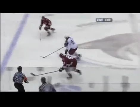 A six-panel compilation of a hockey player in a white jersey with number 61 being hit by a puck while skating, then falling…
