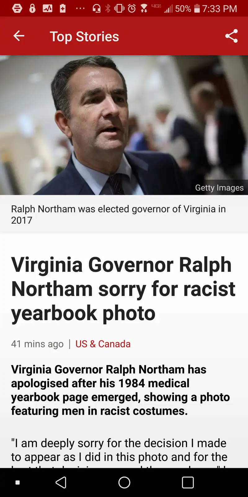 A screenshot of a news article about Virginia Governor Ralph Northam apologizing for a 1984 yearbook photo showing him in a…