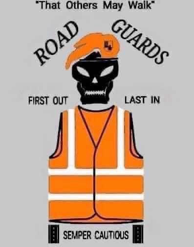 A black skull wearing an orange construction hat and high-visibility vest, with the text 'ROAD GUARDS' arched above, 'FIRST…