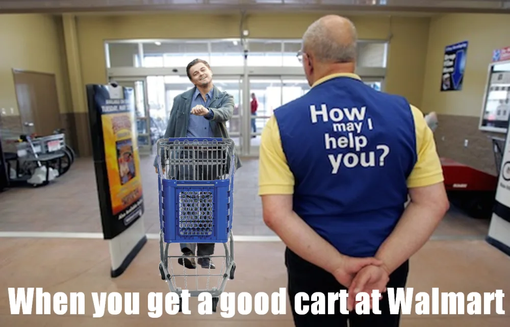 A man in a Walmart employee vest with 'How may I help you?' on the back stands facing another man who is smiling and…