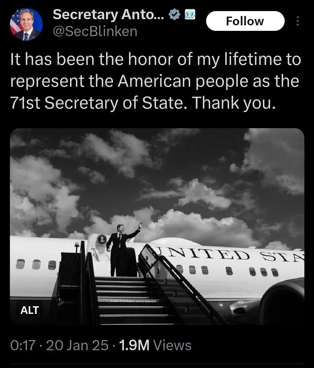 A black-and-white image shows a man in a suit waving from the stairs of a large airplane with 'UNITED STA' visible on its…