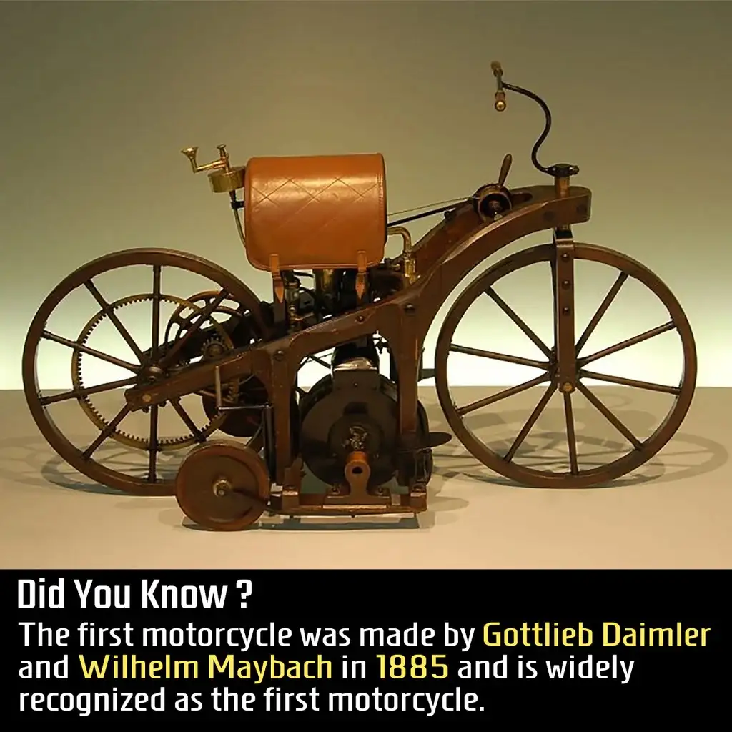 An image of a vintage, early 1880s motorcycle with large spoked wheels, a leather saddle, and exposed mechanical components…