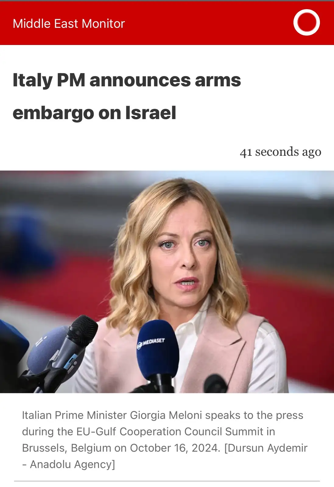 A screenshot of a news article from 'Middle East Monitor' shows Italian Prime Minister Giorgia Meloni speaking at a press…