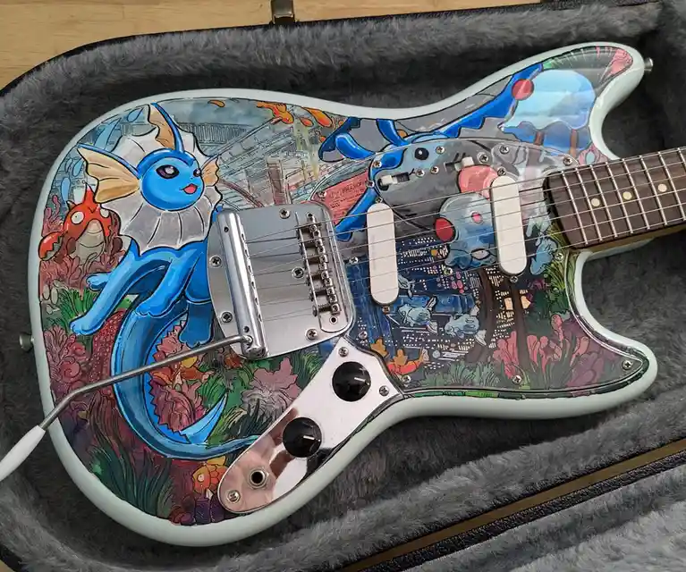 A custom electric guitar with a light blue body is shown inside a grey plush case. The guitar's body is fully hand-painted…