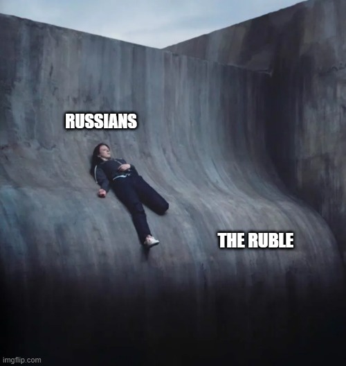 A person is lying relaxed on a steep, curved concrete wall, with the text 'RUSSIANS' above them and 'THE RUBLE' below them…