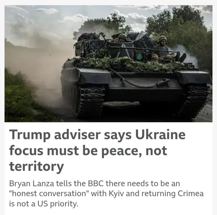 A military tank with soldiers on top drives through a dusty rural road, kicking up dirt. Overlaid text reads: 'Trump adviser…