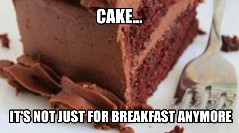 A close-up photo shows a slice of rich chocolate cake with chocolate frosting on a white plate, next to a silver fork. The…