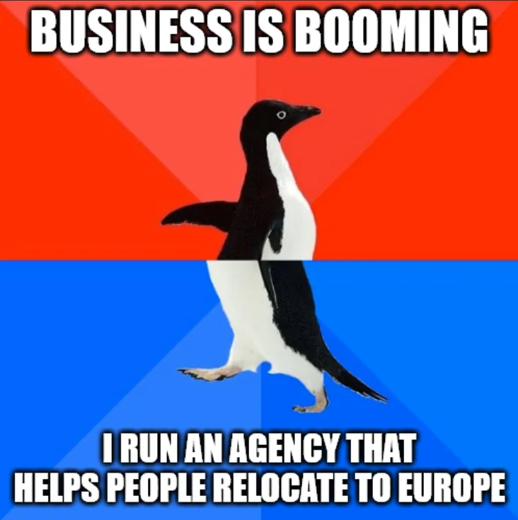A penguin walks forward against a red and blue background, with the text 'BUSINESS IS BOOMING' at the top and 'I RUN AN…