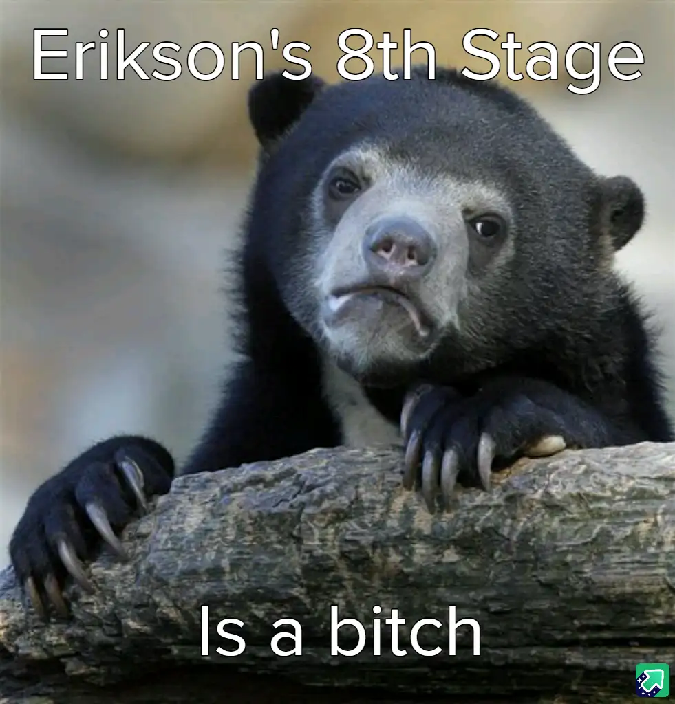 A close-up photo of a sad-looking spectacled bear resting its paws on a log, with white text overlaid at the top reading…