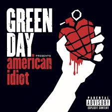 A black background features a white silhouette of a hand holding a red, grid-patterned grenade with dripping blood. The text…