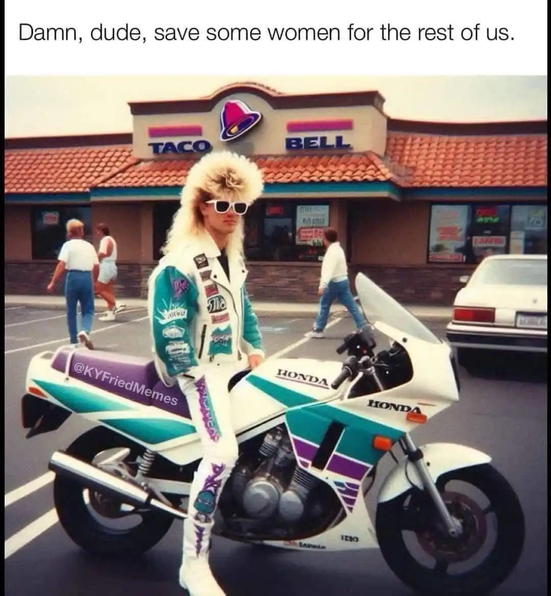 A man with a large, teased blonde mullet and white sunglasses sits confidently on a white and teal Honda motorcycle in a…