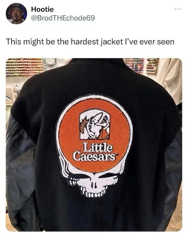 The image shows the back of a black jacket with a large, circular patch that combines the iconic Grateful Dead skull and…