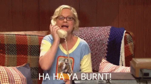 A woman with blonde hair and glasses is shown in six identical panels, each time holding a beige rotary phone to her ear and…