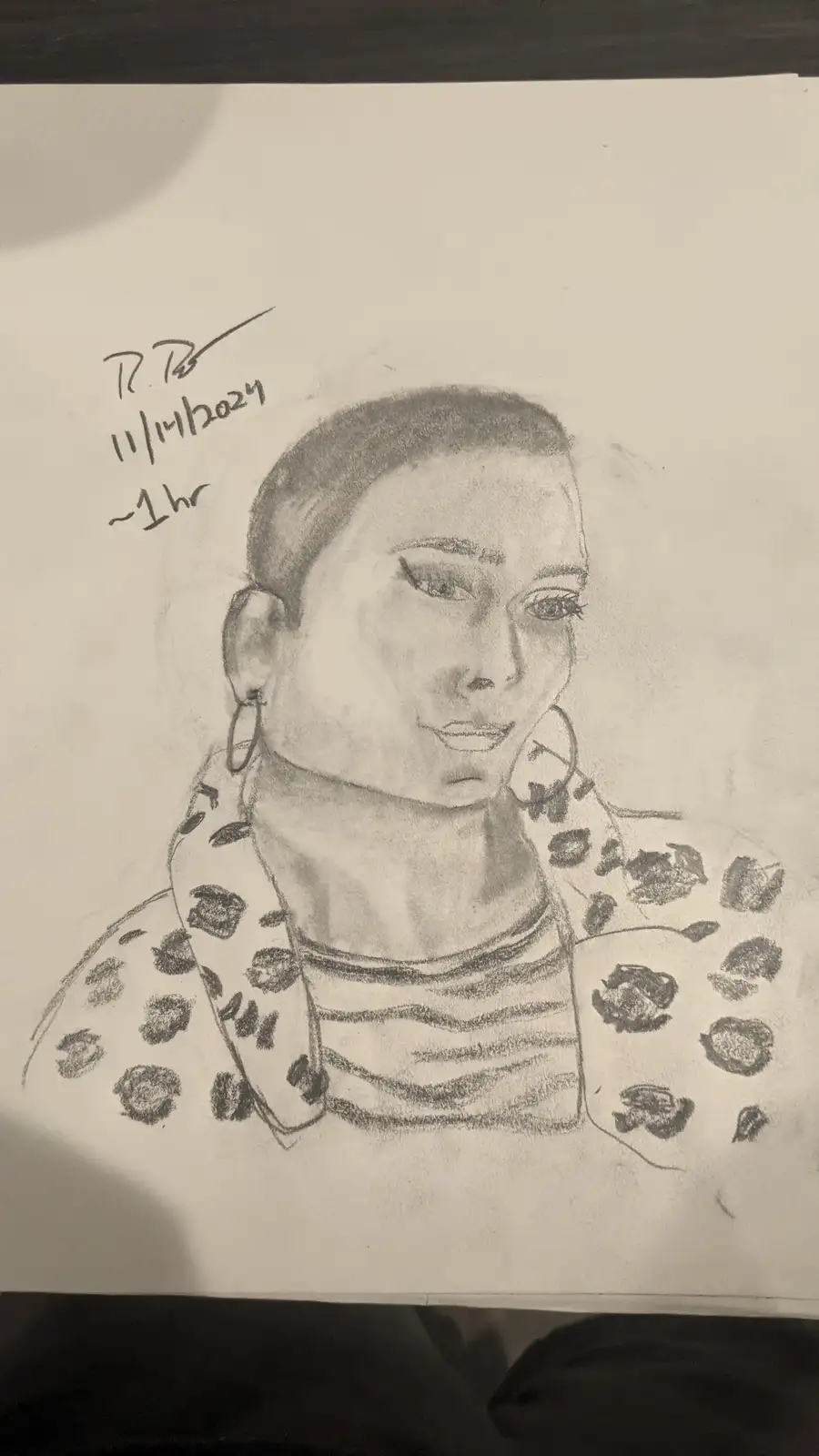 A pencil sketch of a person with a shaved head, wearing large hoop earrings and a leopard-print jacket over a striped shirt…