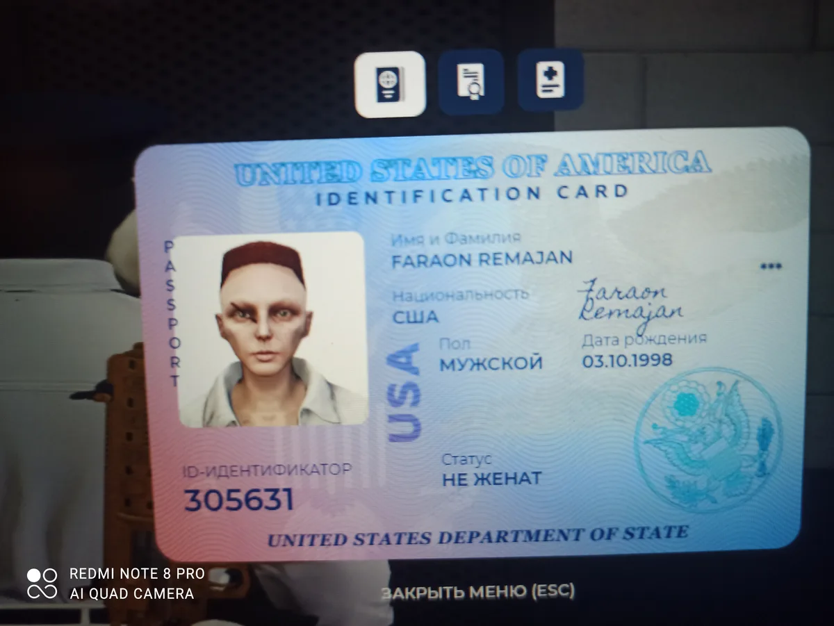 A screenshot of a U.S. identification card displayed on a screen, featuring a photo of a person with a shaved head and pale…