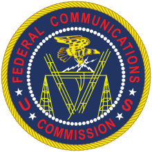 The image displays the official seal of the Federal Communications Commission (FCC), featuring a bald eagle clutching…