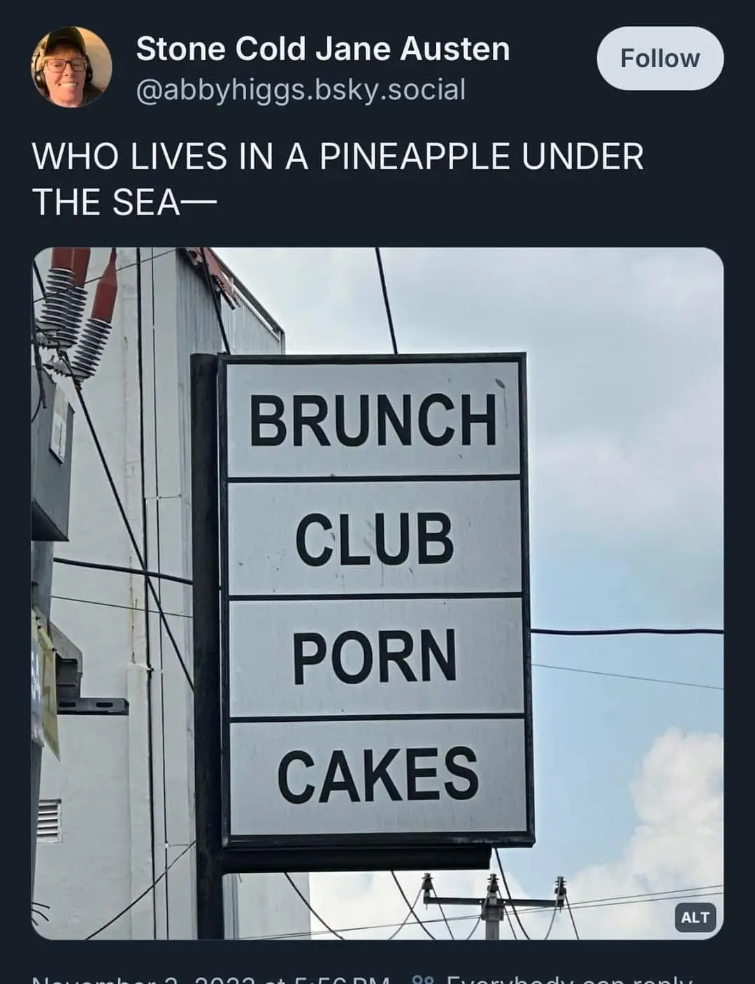 A vertical sign with four black-lettered white panels reads 'BRUNCH', 'CLUB', 'PORN', and 'CAKES'. Above the image, text…