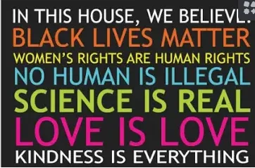A black background with bold, colorful text listing progressive values: 'IN THIS HOUSE, WE BELIEVE: BLACK LIVES MATTER…