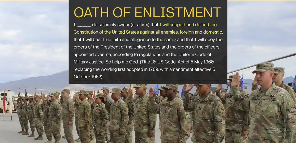 A group of U.S. Army soldiers in camouflage uniforms stand in formation outdoors, raising their right hands to take an oath…