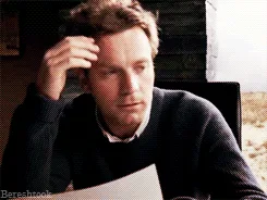 A six-panel image sequence shows actor Ewan McGregor seated at a table, initially looking thoughtful while holding a paper…