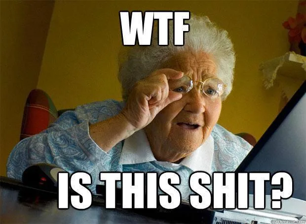 An elderly woman with white hair and glasses, wearing a blue patterned shirt, sits in front of a laptop, adjusting her…