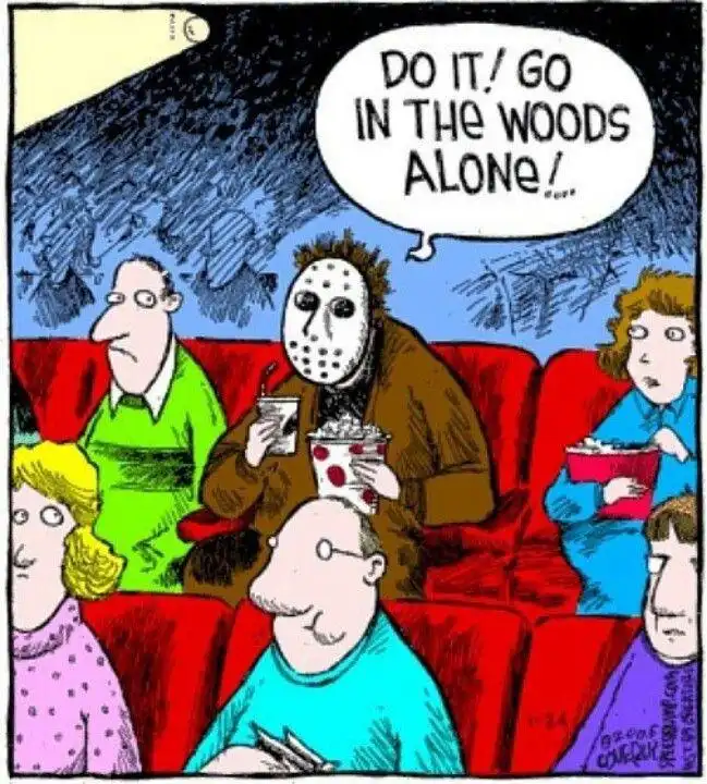 A cartoon depicts a group of people sitting in a movie theater, with one person wearing a Jason Voorhees hockey mask and…