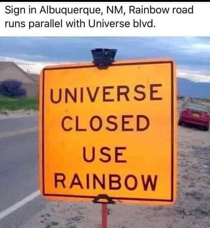 A yellow road sign reads 'UNIVERSE CLOSED USE RAINBOW' in bold black letters. Above the image, text states 'Sign in…