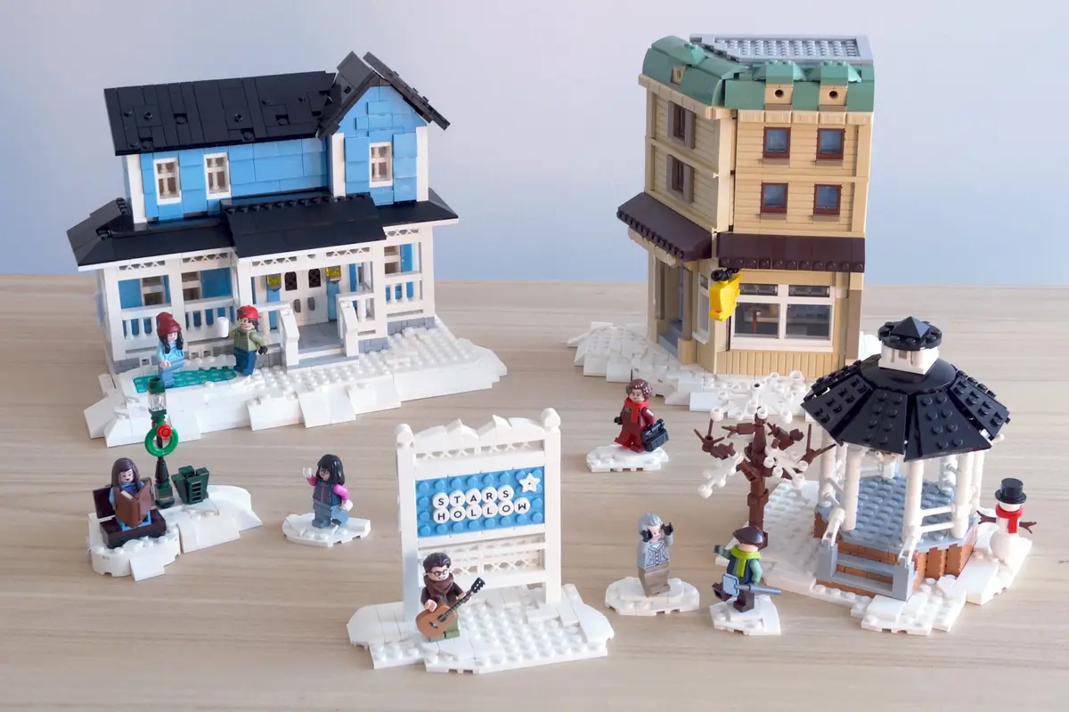A LEGO diorama of the fictional town Stars Hollow from the TV show 'Gilmore Girls', featuring miniature LEGO buildings…