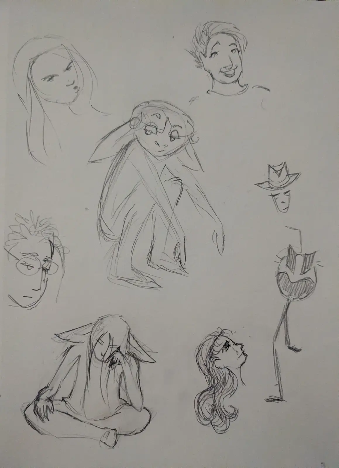 A sheet of pencil sketches shows various anime-style character designs, including a central figure with long hair and a sad…