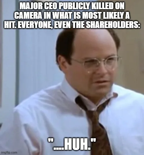 A still image of the character Michael Scott from The Office, wearing a white shirt and tie, looking confused with a blank…